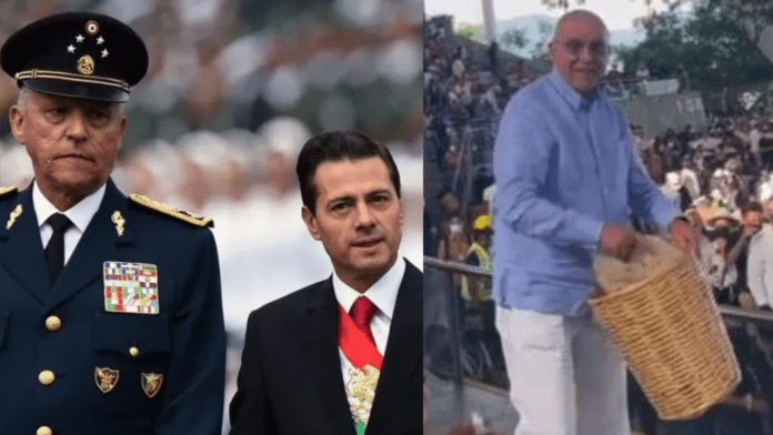 Captan a Salvador Cienfuegos en la Guelaguetza regalando tlayudas