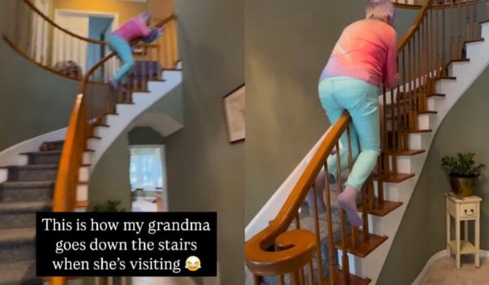 Increíble: Abuela sorprende al deslizarse de espaldas por el barandal de las escaleras